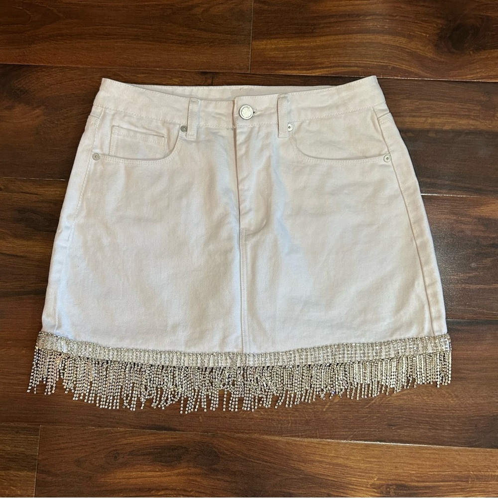 White denim mini skirt with silver fringe